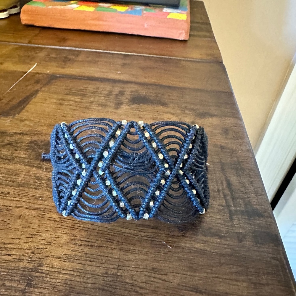 Black woven adjustable bracelet with silver beading